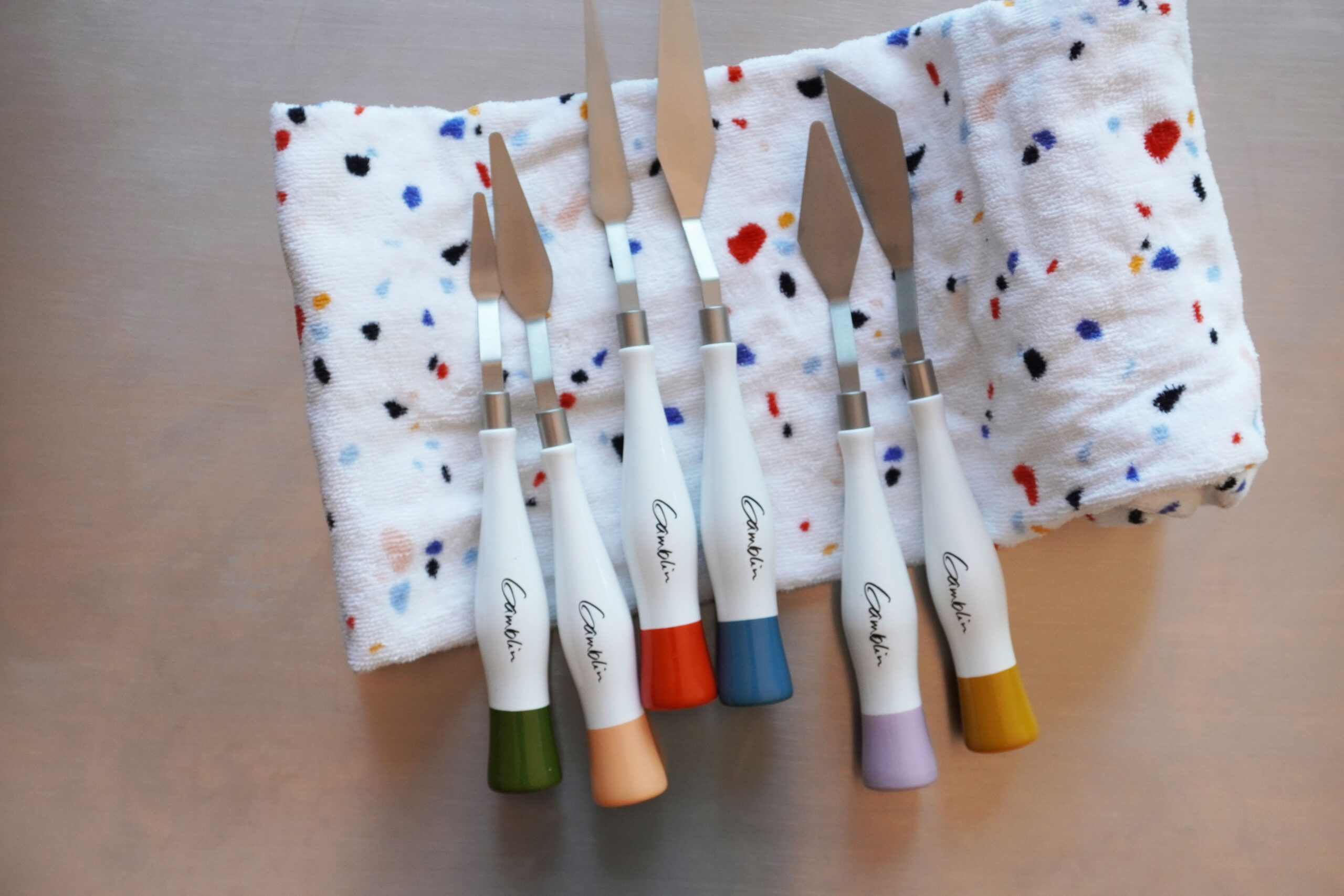 Gamblin palette knives, studio knives on colorful towel